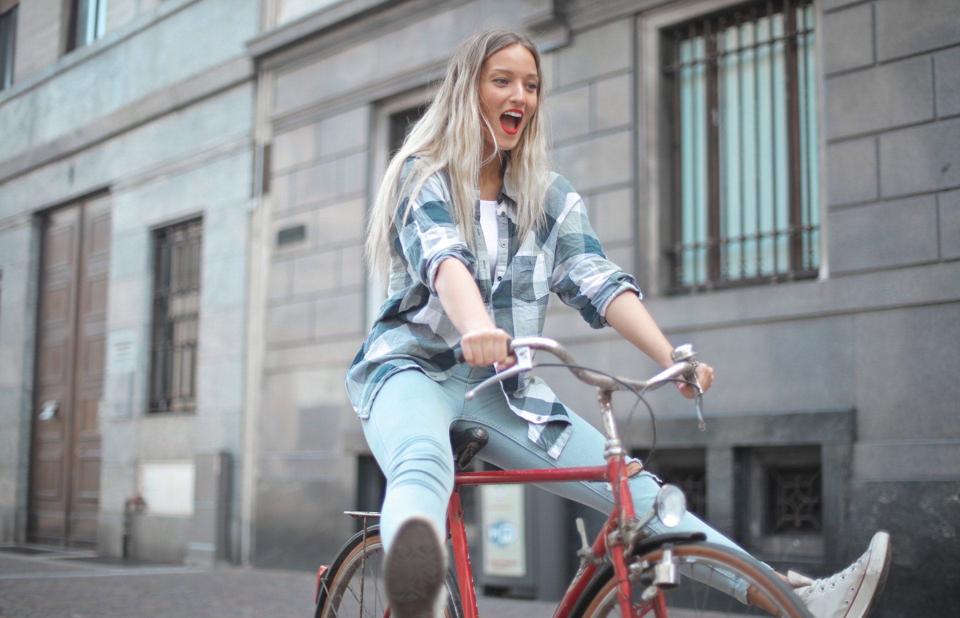 woman going wild on a bicycle